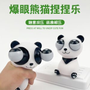 Black-and-white panda squeeze toy with pop-out eyes