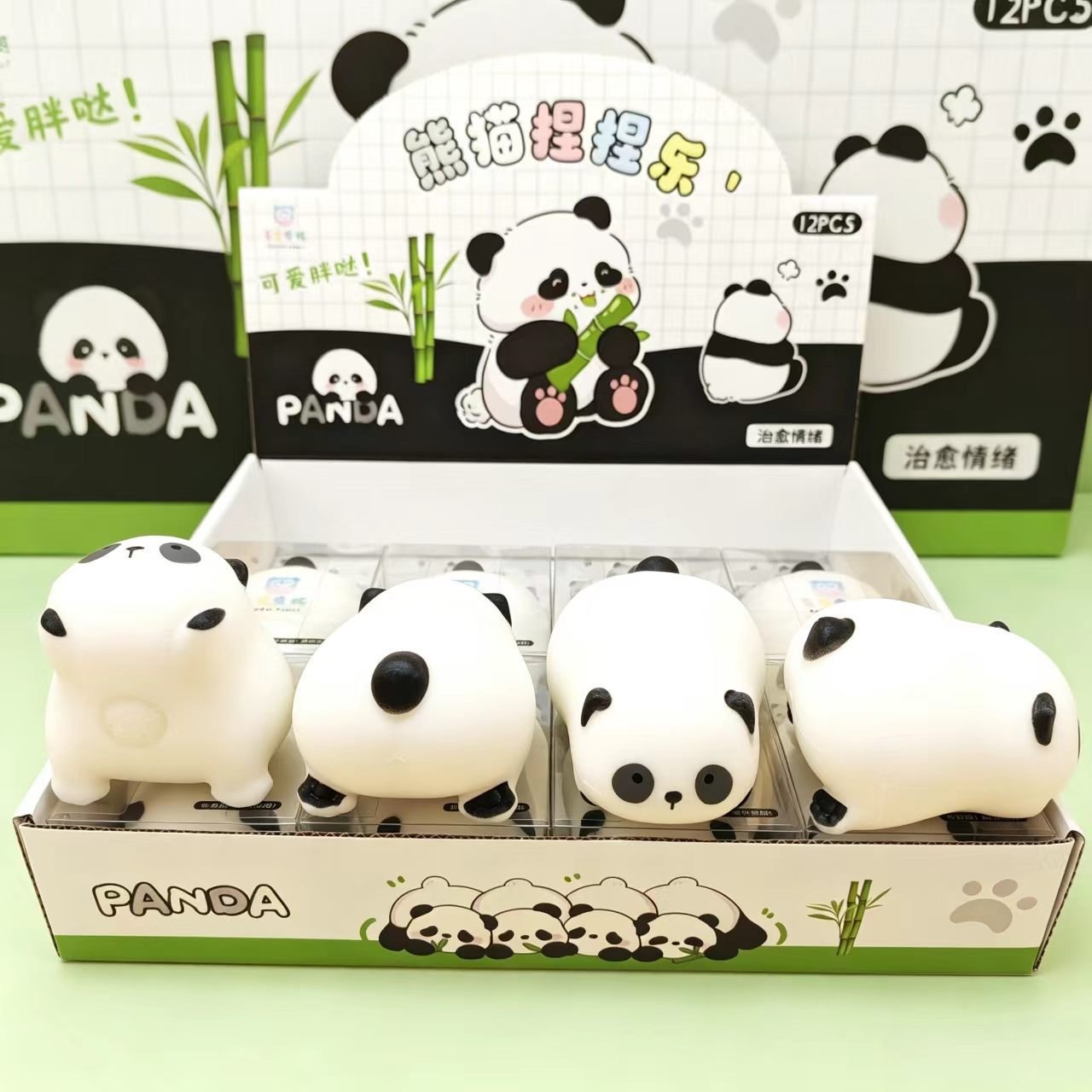Panda squishy toys arranged in their panda-themed display box