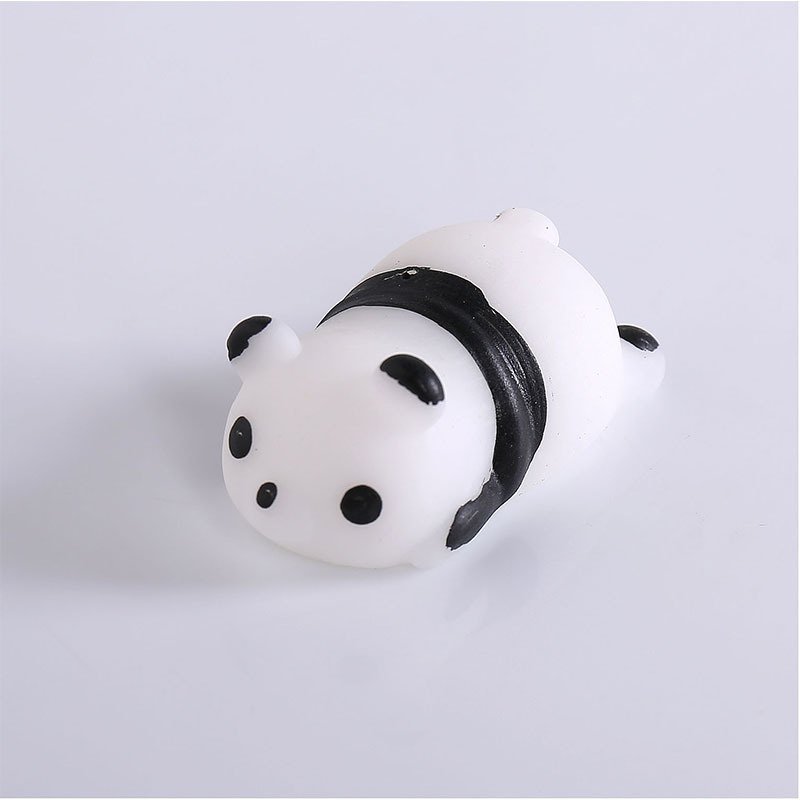 A compact panda squishy with a rounded white body, black ears and a broad black band across its middle