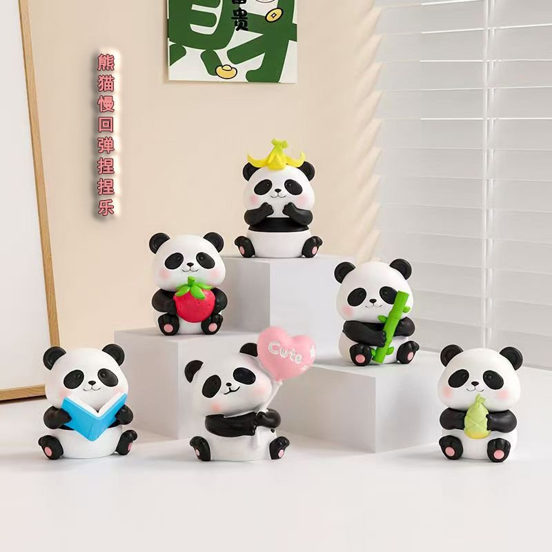 A selection of seated panda squeeze-toy designs shown with playful props
